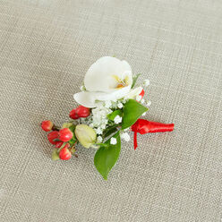 ORCHID & HYPERICUM GROOM BUTTONHOLE